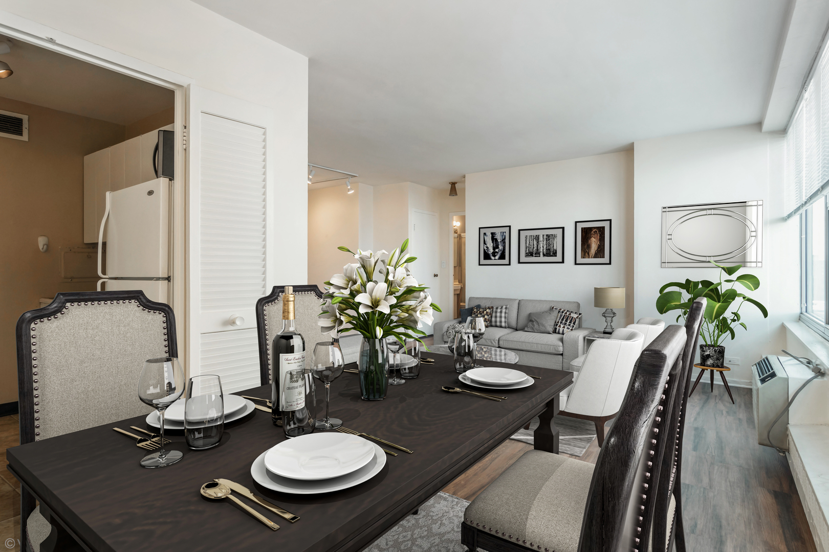 3900 North Lake Shore Drive, Unit 9J Chicago, IL 60613 - Photo 7 of 18 a view of a dining room with furniture and wooden floor