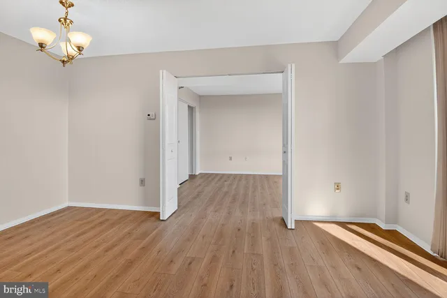 a view of room with wooden floor