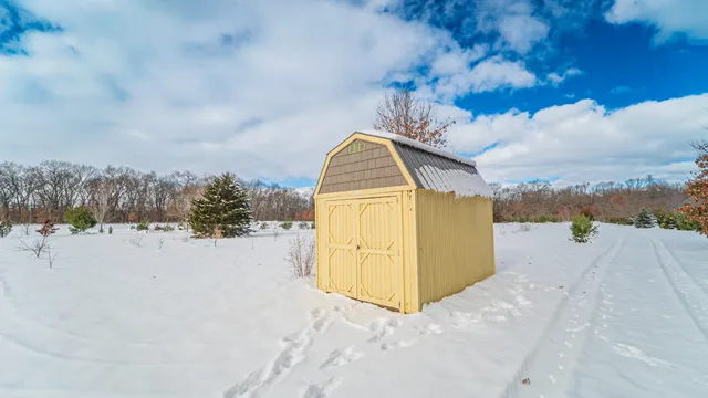 a view of a swimming pool with an outdoor seating