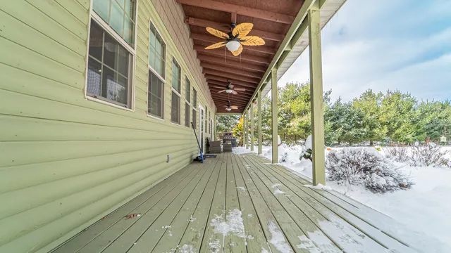 a view of a house with backyard and wooden floor