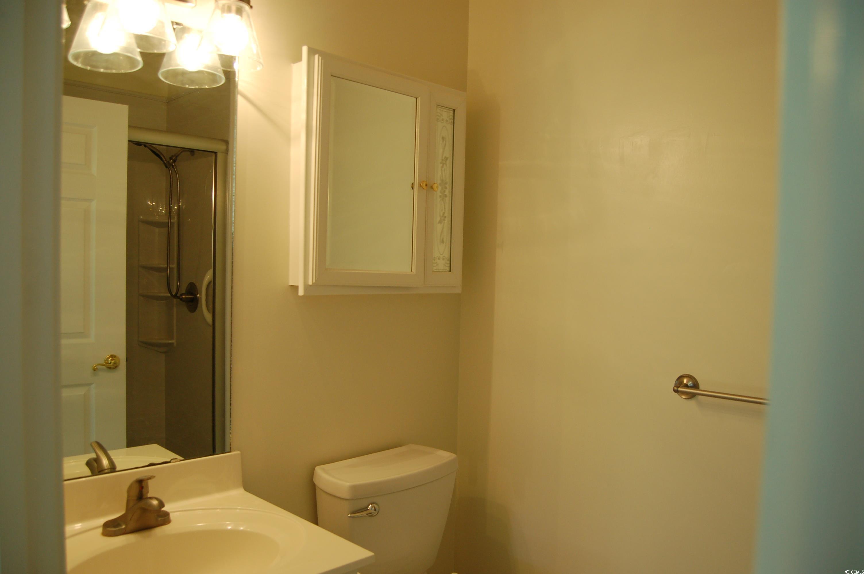 1537 Lanterns Rest Road, Unit 203 Myrtle Beach, SC 29579 - Photo 12 of 35 Bathroom with a shower stall and vanity