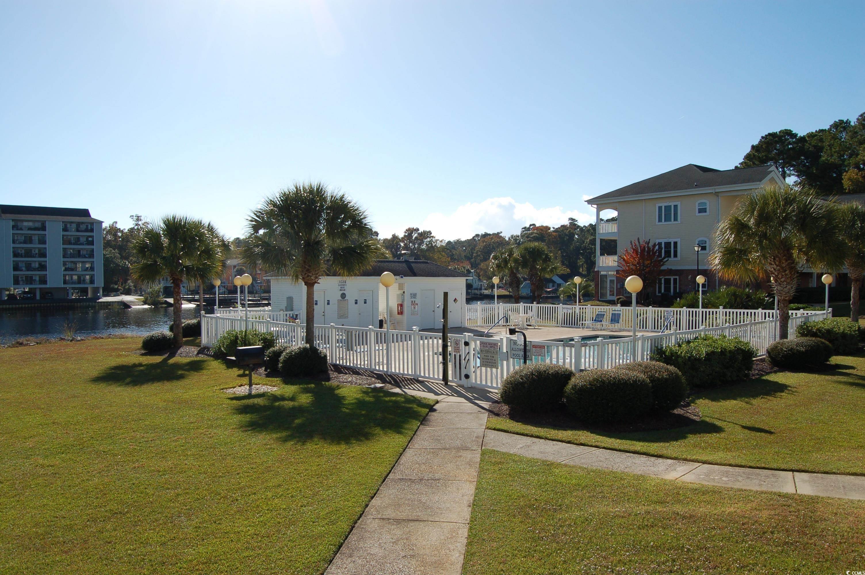 1537 Lanterns Rest Road, Unit 203 Myrtle Beach, SC 29579 - Photo 33 of 35 View of property's community with a water view and a swimming pool