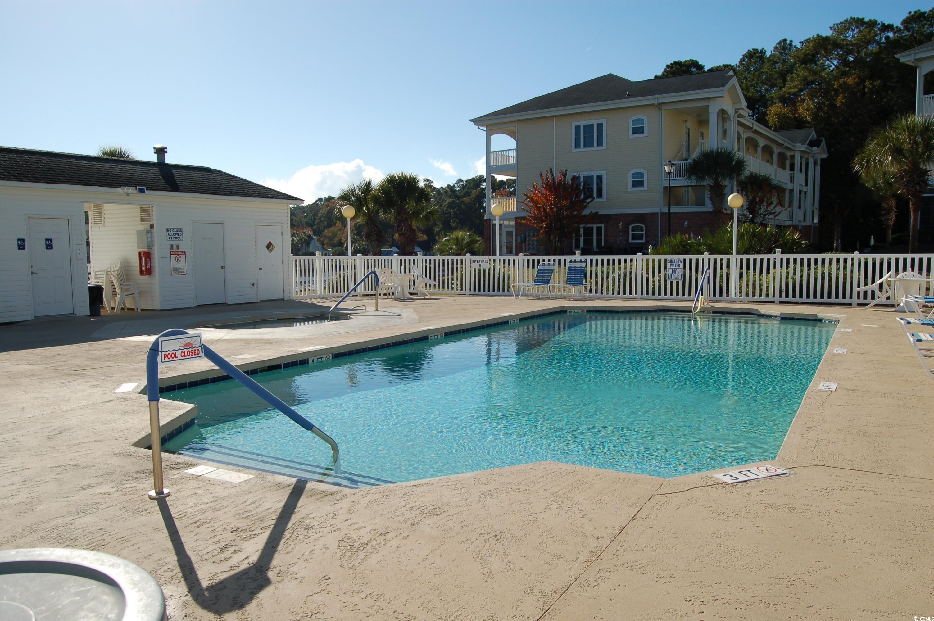 1537 Lanterns Rest Road, Unit 203 Myrtle Beach, SC 29579 - Photo 35 of 35 Community pool featuring a patio area