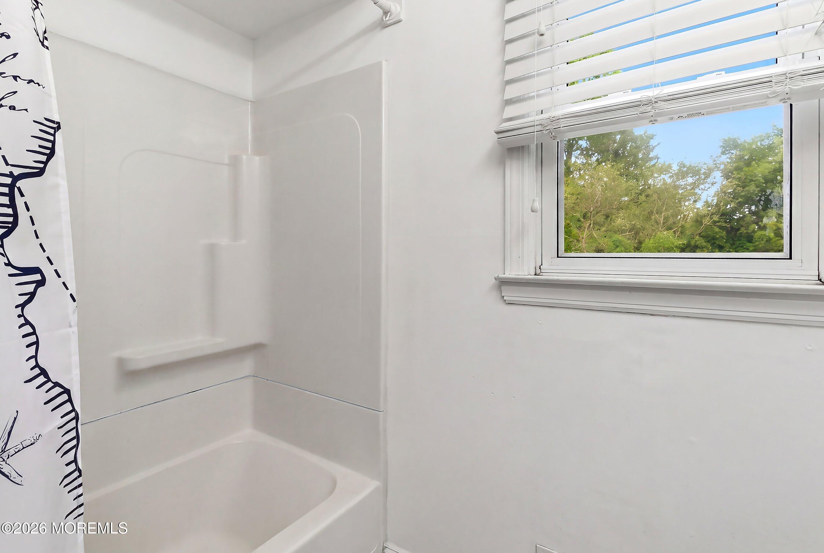 822 York Road Brick, NJ 08724 - Photo 23 of 37 a white bath tub sitting next to a window