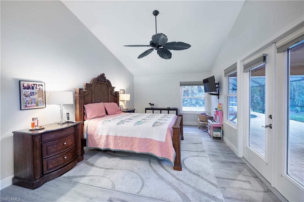 5340 Tamarind Ridge Drive Naples, FL 34119 - Photo 11 of 32 a bed room with a bed and dresser