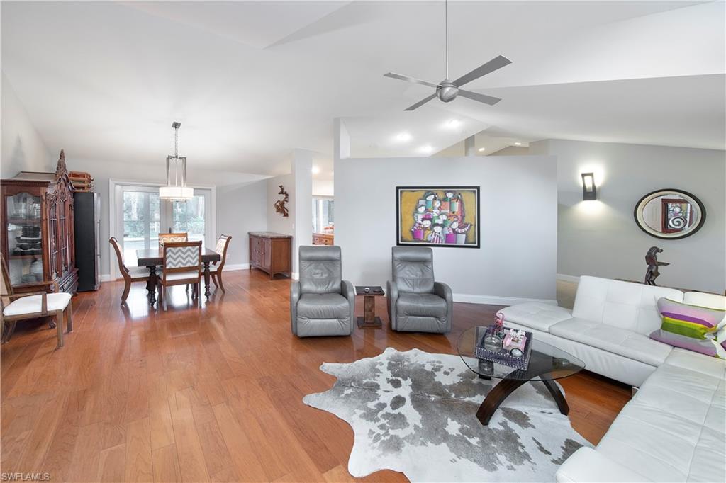 5340 Tamarind Ridge Drive Naples, FL 34119 - Photo 19 of 32 a living room with furniture and wooden floor