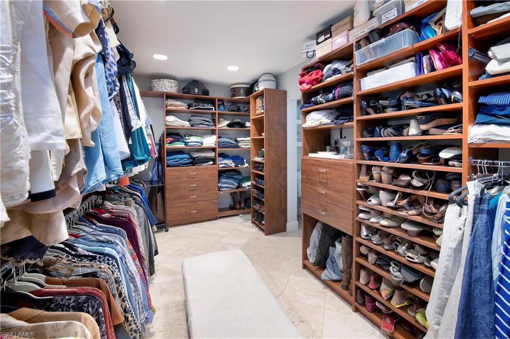 5340 Tamarind Ridge Drive Naples, FL 34119 - Photo 25 of 32 a view of walk in closet with clothes and shoes