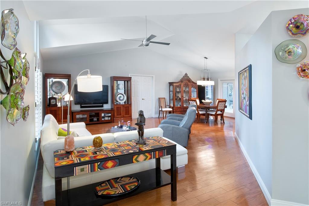5340 Tamarind Ridge Drive Naples, FL 34119 - Photo 26 of 32 a living room with furniture and a flat screen tv