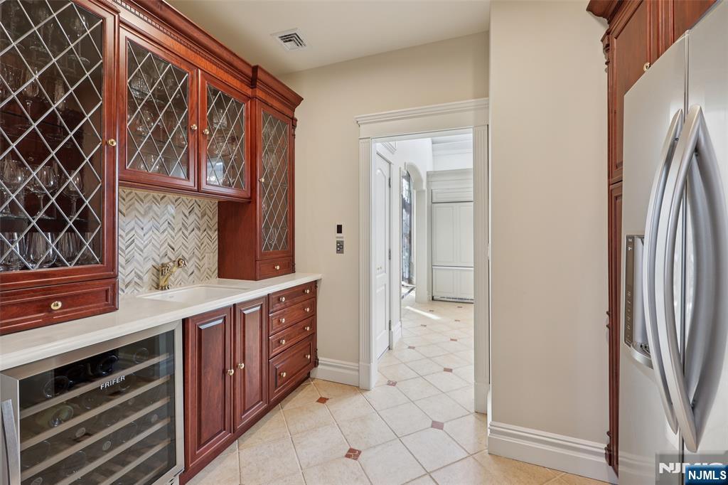 14 Henion Garden Mahwah, NJ 07430 - Photo 13 of 38 a spacious bathroom with a sink a mirror and a shower