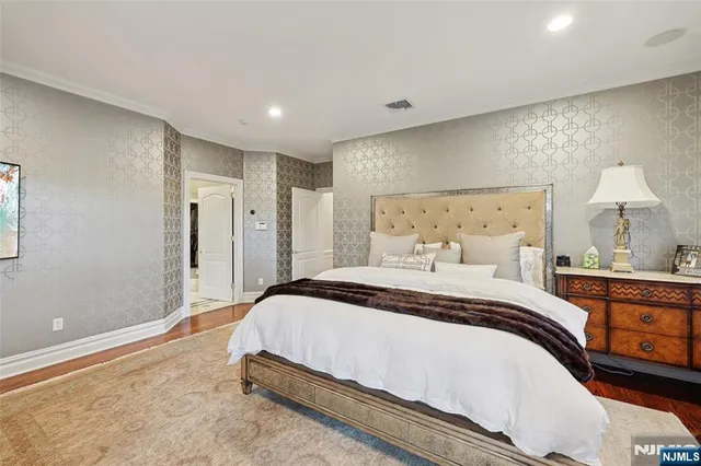 a spacious bedroom with a bed and a window