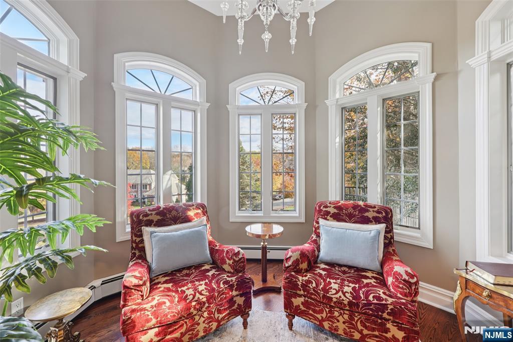 14 Henion Garden Mahwah, NJ 07430 - Photo 20 of 38 a living room with patio furniture and a large window