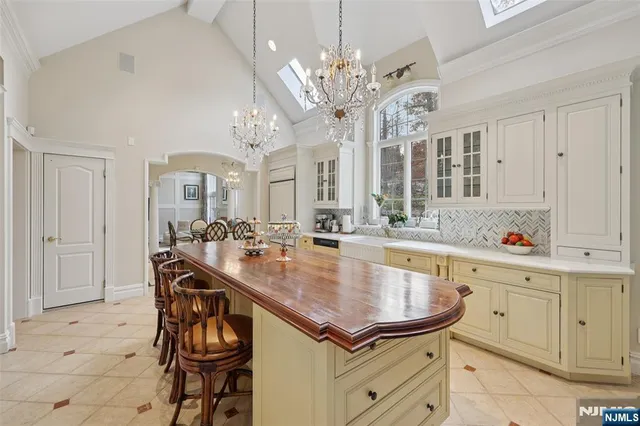 a kitchen with a table and chairs in it