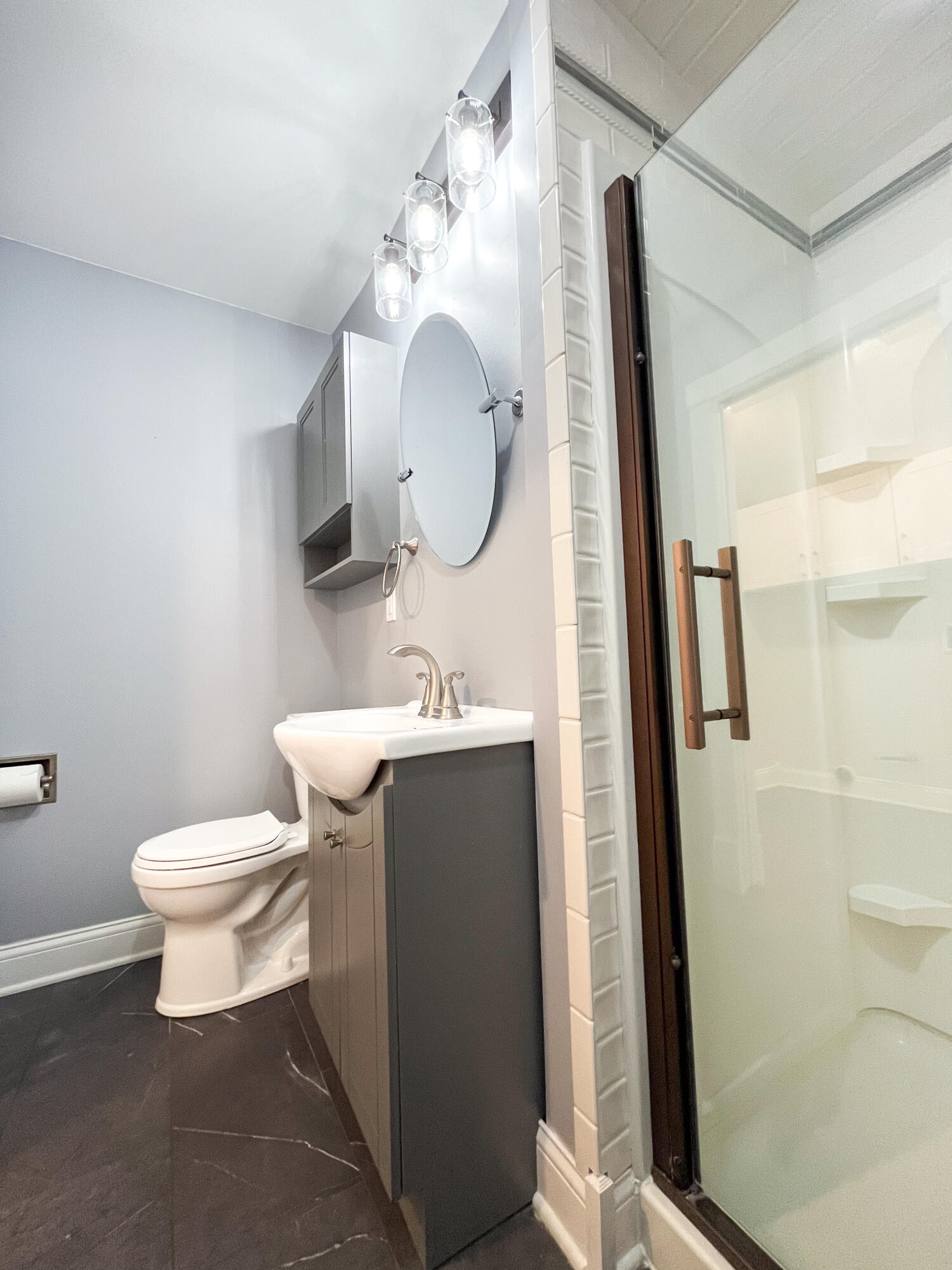 509 North Main Street Hebron, IN 46341 - Photo 12 of 27 a bathroom with a toilet sink and mirror