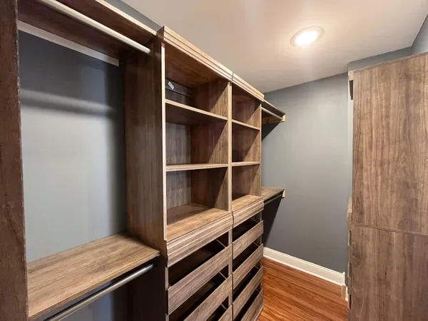 a view of bedroom with wooden floor