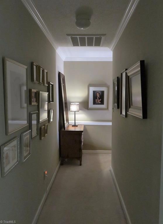 538 Lindley Road Greensboro, NC 27410 - Photo 15 of 29 The upper level hall is spacious and leads to the bedrooms and hall bath.