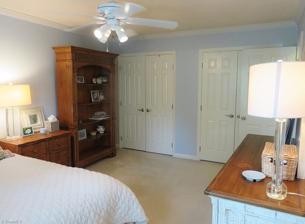 538 Lindley Road Greensboro, NC 27410 - Photo 20 of 29 The 2nd bedroom has wall to wall closets with built-ins.