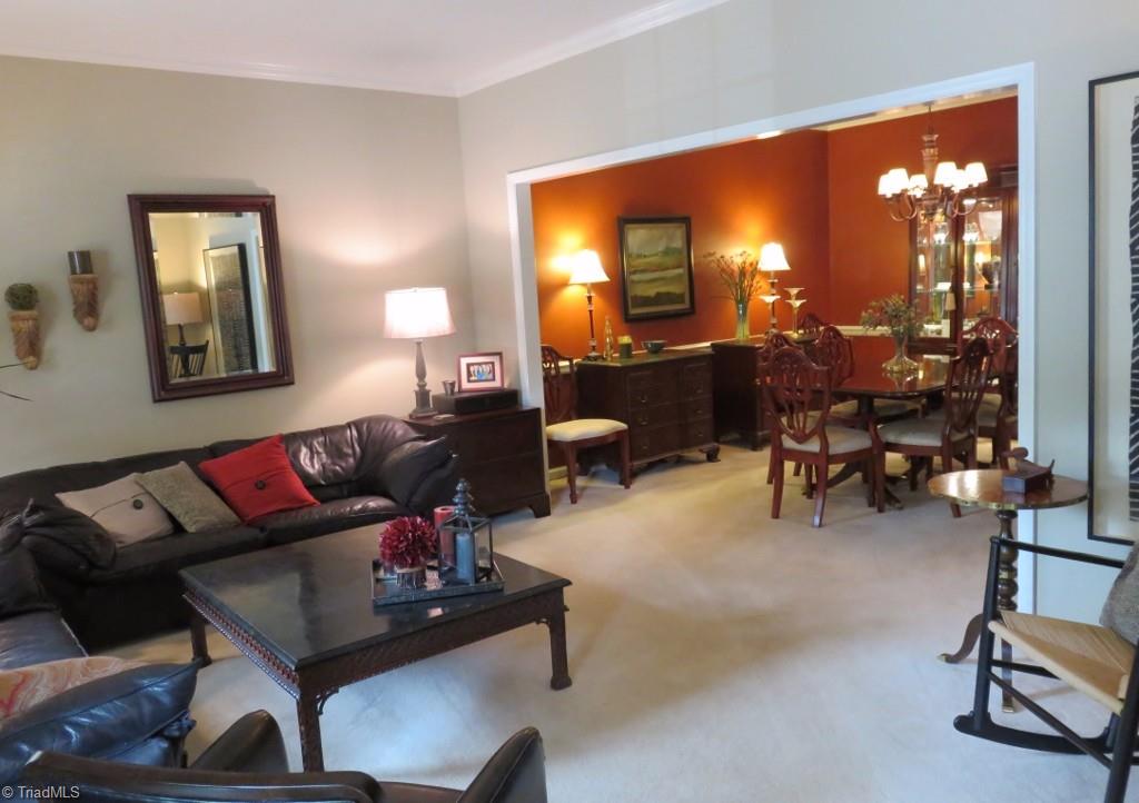 538 Lindley Road Greensboro, NC 27410 - Photo 3 of 29 Open and spacious this large living room opens to the dining room. Crown molding graces all rooms on each floors.