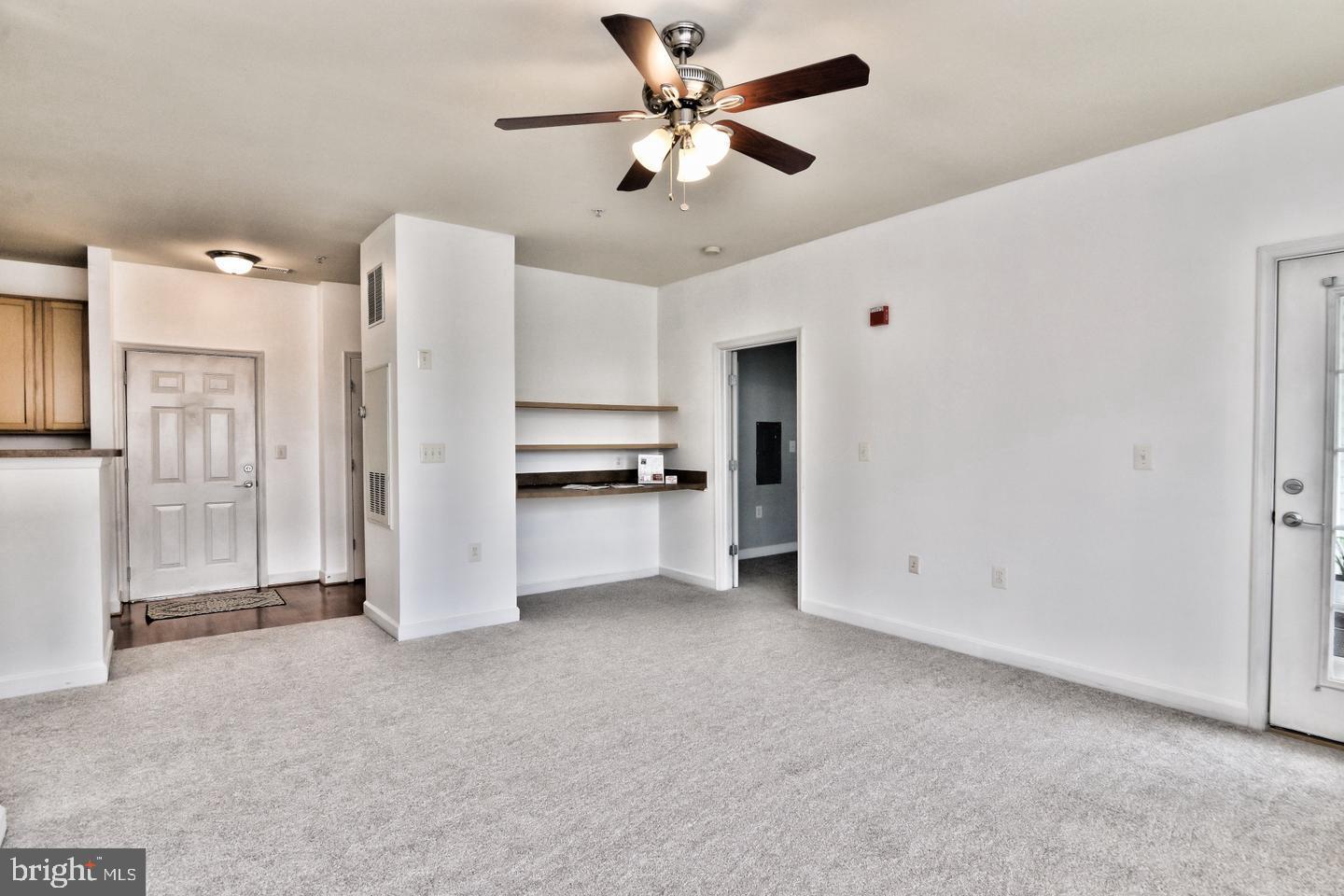 22687 Blue Elder Terrace, Unit 104 Brambleton, VA 20148 - Photo 11 of 23 a view of a kitchen with refrigerator and a ceiling fan