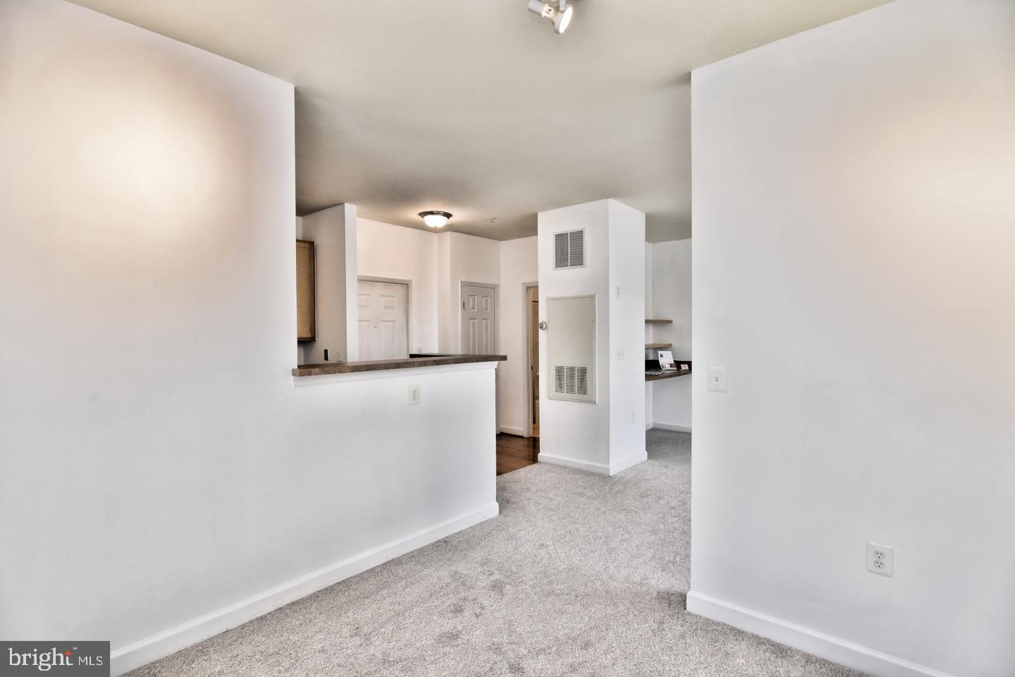 22687 Blue Elder Terrace, Unit 104 Brambleton, VA 20148 - Photo 8 of 23 a view of a refrigerator in kitchen and entryway