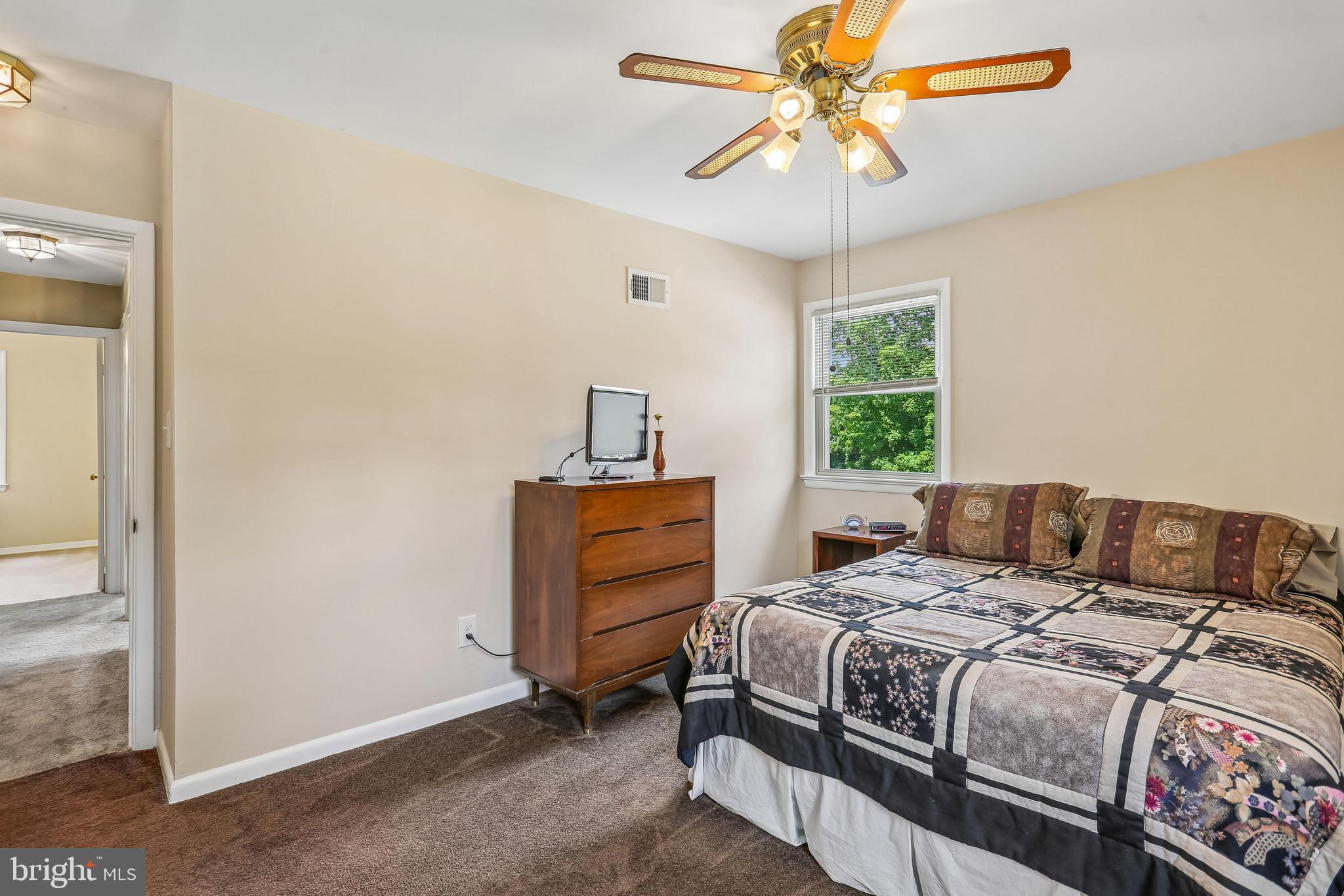 2 Foxhall Court Silver Spring, MD 20906 - Photo 31 of 86 a bedroom with a bed and a chandelier