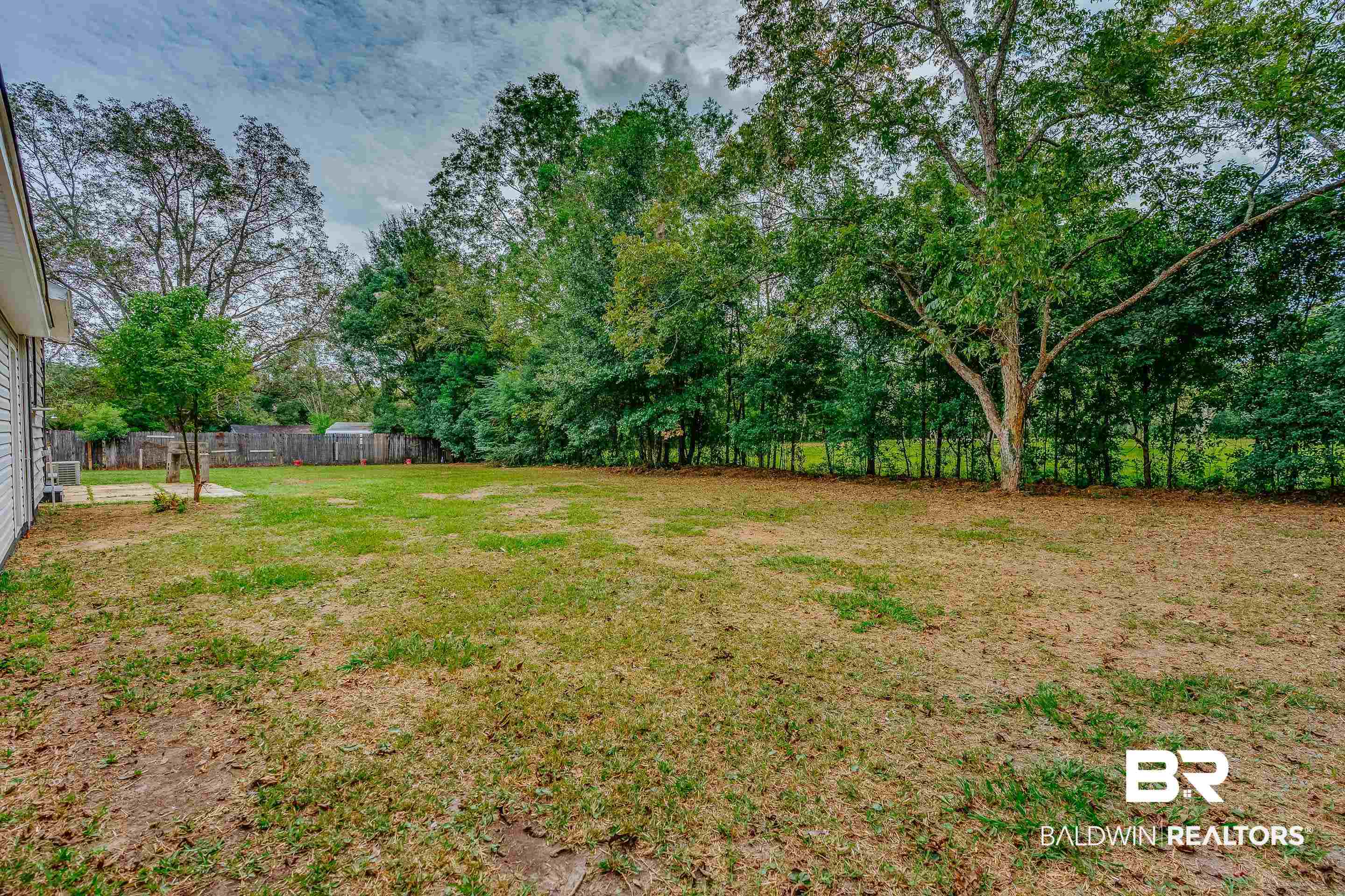 8001 16th Street Irvington, AL 36544 - Photo 28 of 35 View of yard featuring view of scattered trees