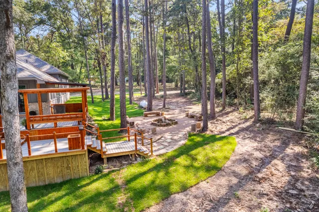 a view of a swimming pool with chairs in the patio