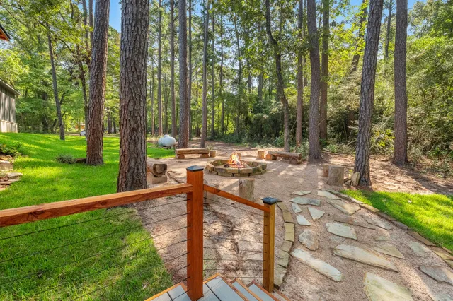 a view of a patio with chairs and a yard