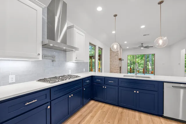 a kitchen with granite countertop a sink cabinets and window