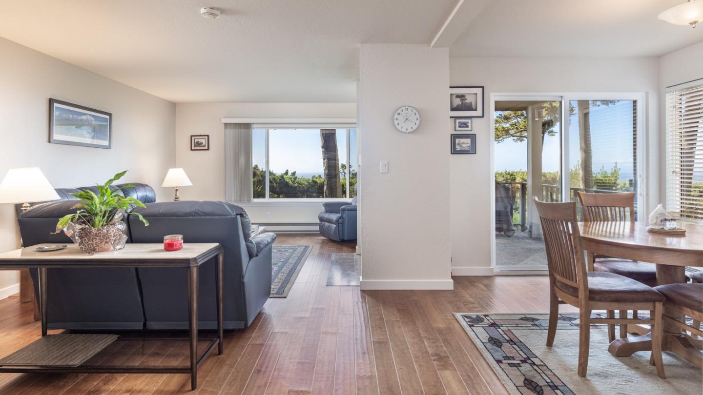 22 Ocean Pines Lane, Unit 22 Pebble Beach, CA 93953 - Photo 6 of 28 a view of a dining room with furniture window and wooden floor