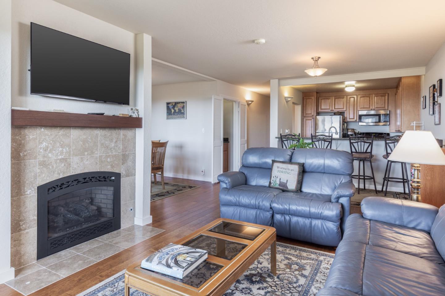 22 Ocean Pines Lane, Unit 22 Pebble Beach, CA 93953 - Photo 8 of 28 a living room with furniture and a fireplace