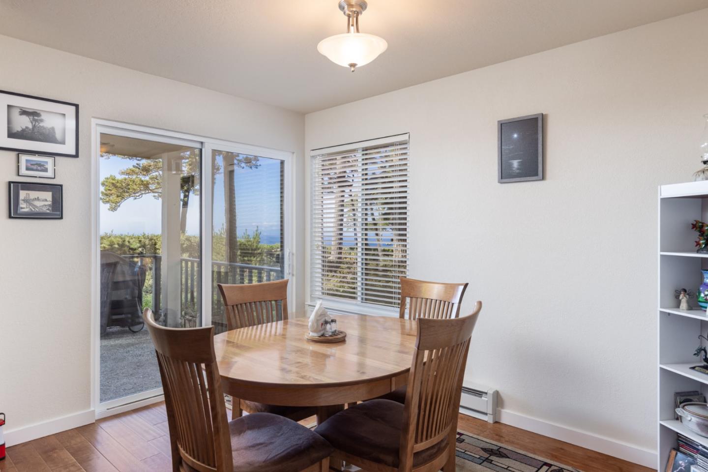 22 Ocean Pines Lane, Unit 22 Pebble Beach, CA 93953 - Photo 9 of 28 a view of a dining room with furniture window and wooden floor