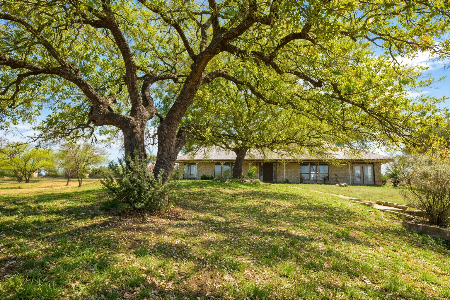 3410 West Ranch Road 152 Llano, TX 78643 - Photo 24 of 36 a front view of a house with a yard