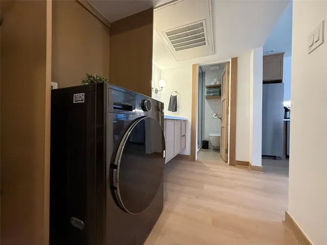 a view of an entryway with wooden floor