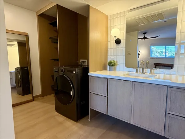 a bathroom with a sink and a mirror