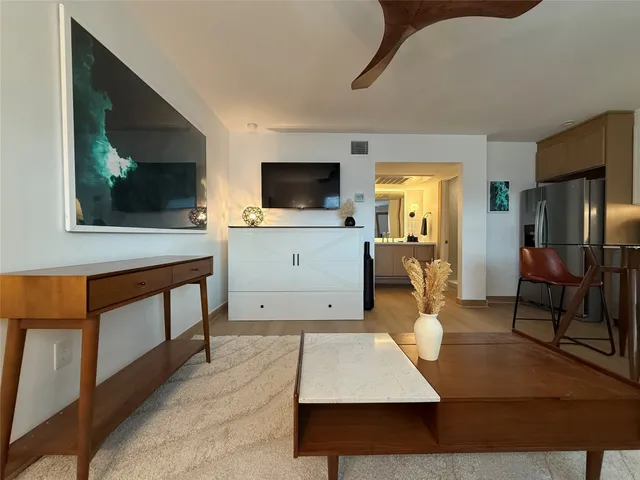 a room with furniture and flat screen tv