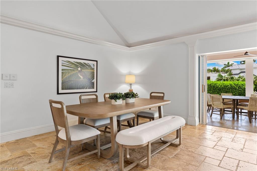 2201 Beacon Lane Naples, FL 34103 - Photo 13 of 25 a view of a dining room with furniture window and outside view
