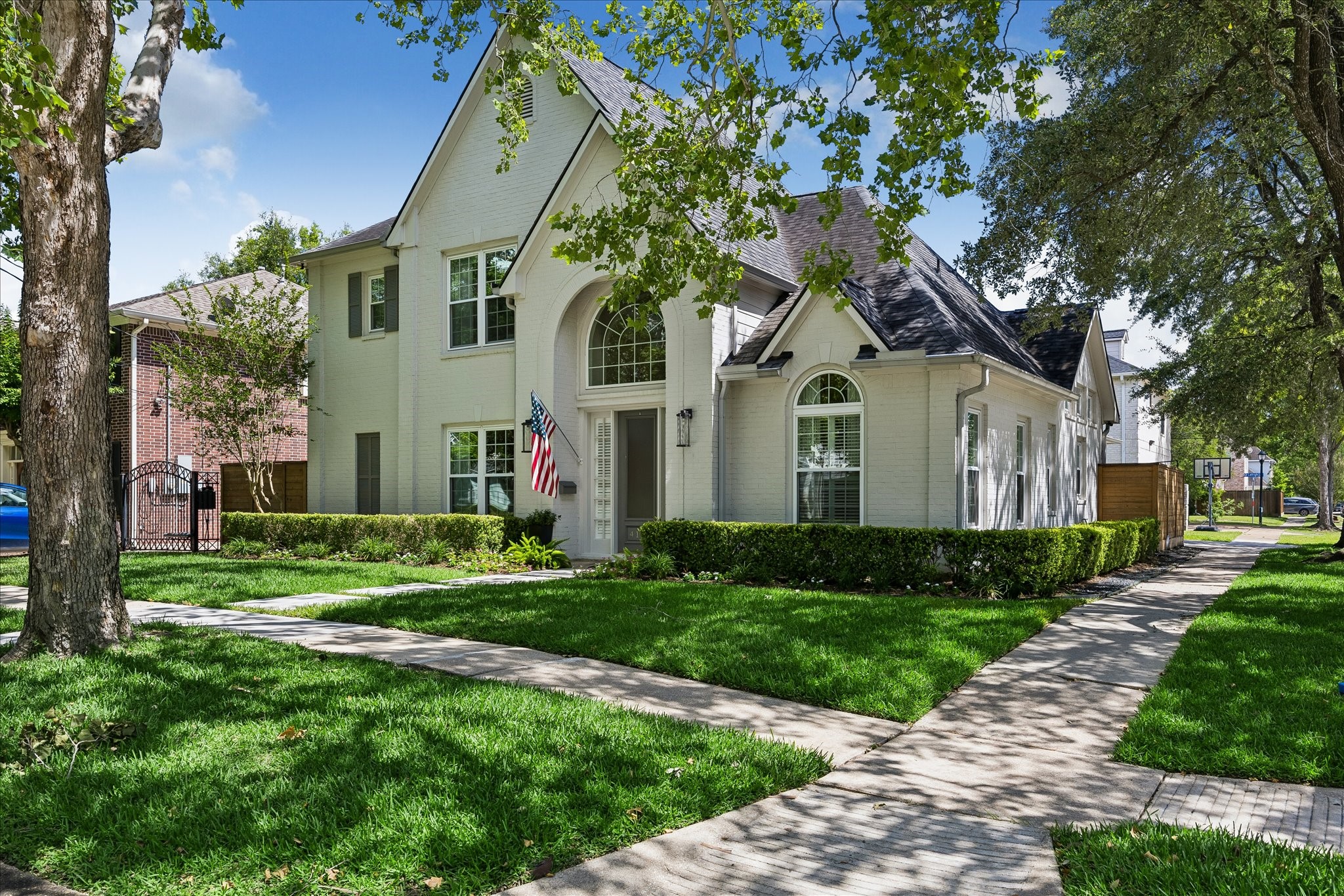 4131 Sunset Boulevard Houston, TX 77005 - Photo 3 of 38 a front view of a house with a yard and garage