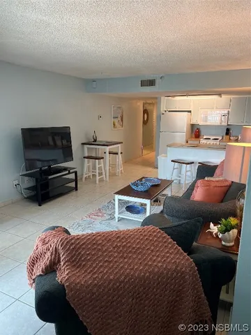 a bedroom with a large bed and a dresser