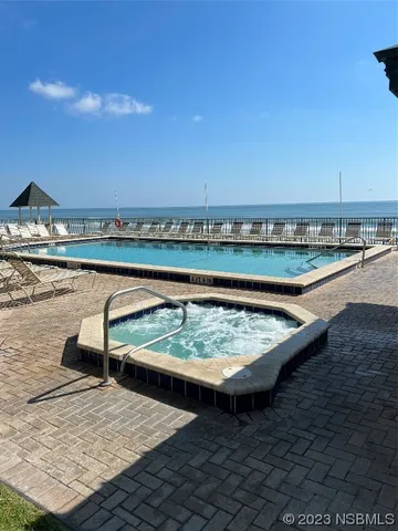 a view of swimming pool from a balcony