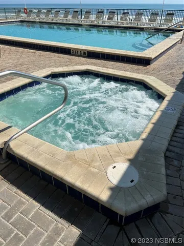 a table and chairs sitting in front of a building