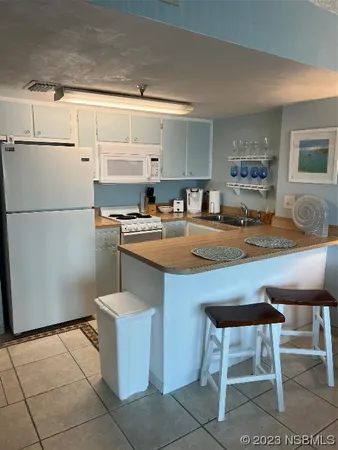 a kitchen with a stove and cabinets