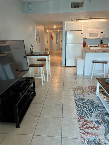 a living room with furniture a window and a table