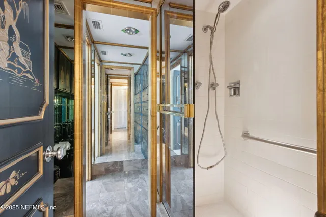 a view of entryway and hall with wooden floor