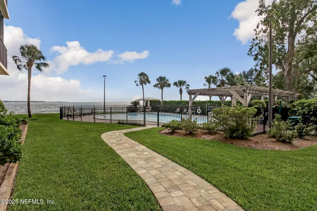 a view of room with furniture and a window
