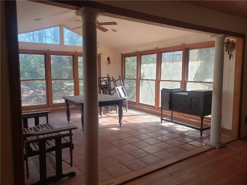 3553 Vanet Road Chamblee, GA 30341 - Photo 15 of 30 a view of a livingroom with furniture wooden floor and a floor to ceiling window