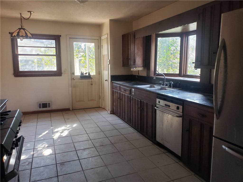 3553 Vanet Road Chamblee, GA 30341 - Photo 8 of 30 a kitchen with a sink a window and cabinets