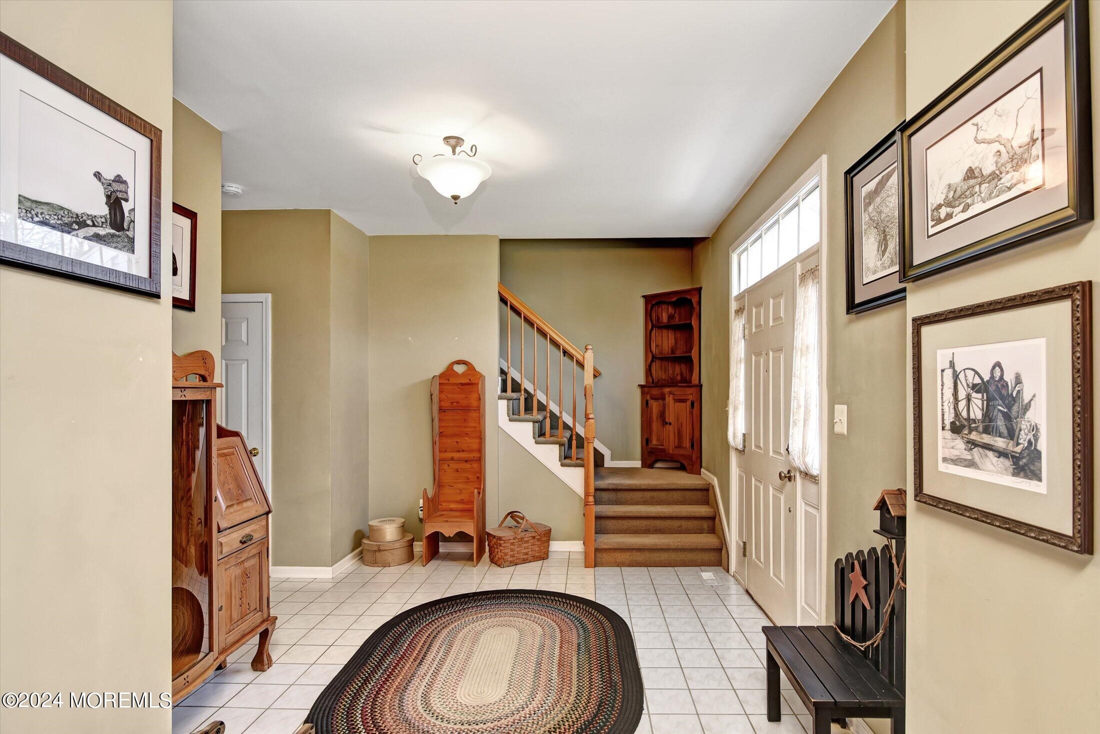 265 Leesville Road Jackson, NJ 08527 - Photo 3 of 38 a view of a livingroom with furniture and stairs