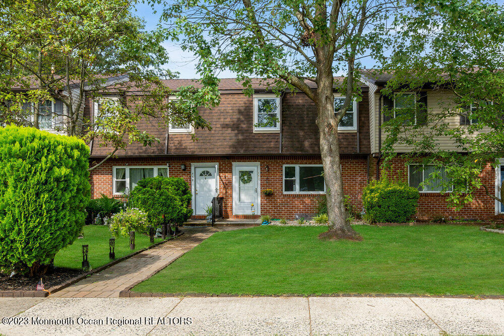570 Labanna Court Brick, NJ 08724 - Photo 1 of 28 a front view of a house with a yard and trees