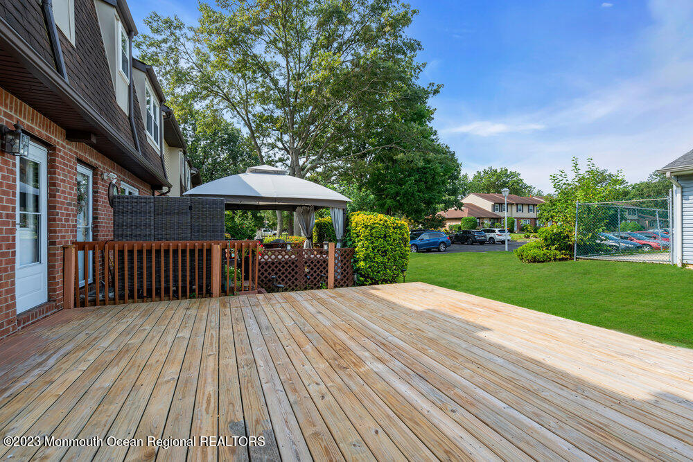570 Labanna Court Brick, NJ 08724 - Photo 19 of 28 a view of backyard with deck and outdoor seating