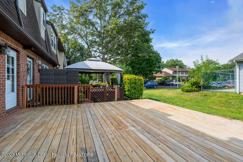 570 Labanna Court Brick, NJ 08724 - Photo 26 of 28 a view of backyard with deck and outdoor seating